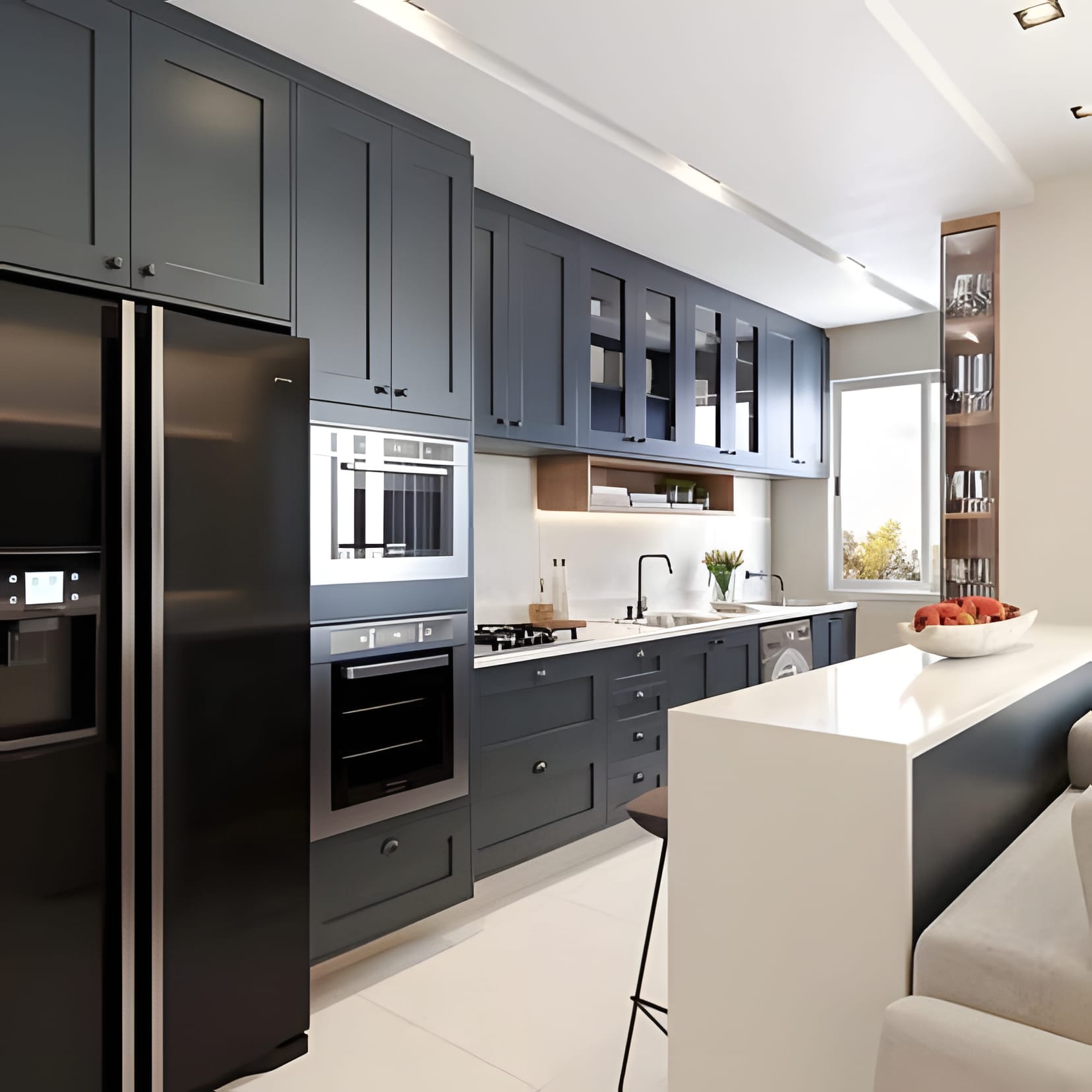 A classic navy kitchen with a black glass fridge and a white island workbench at its centre.