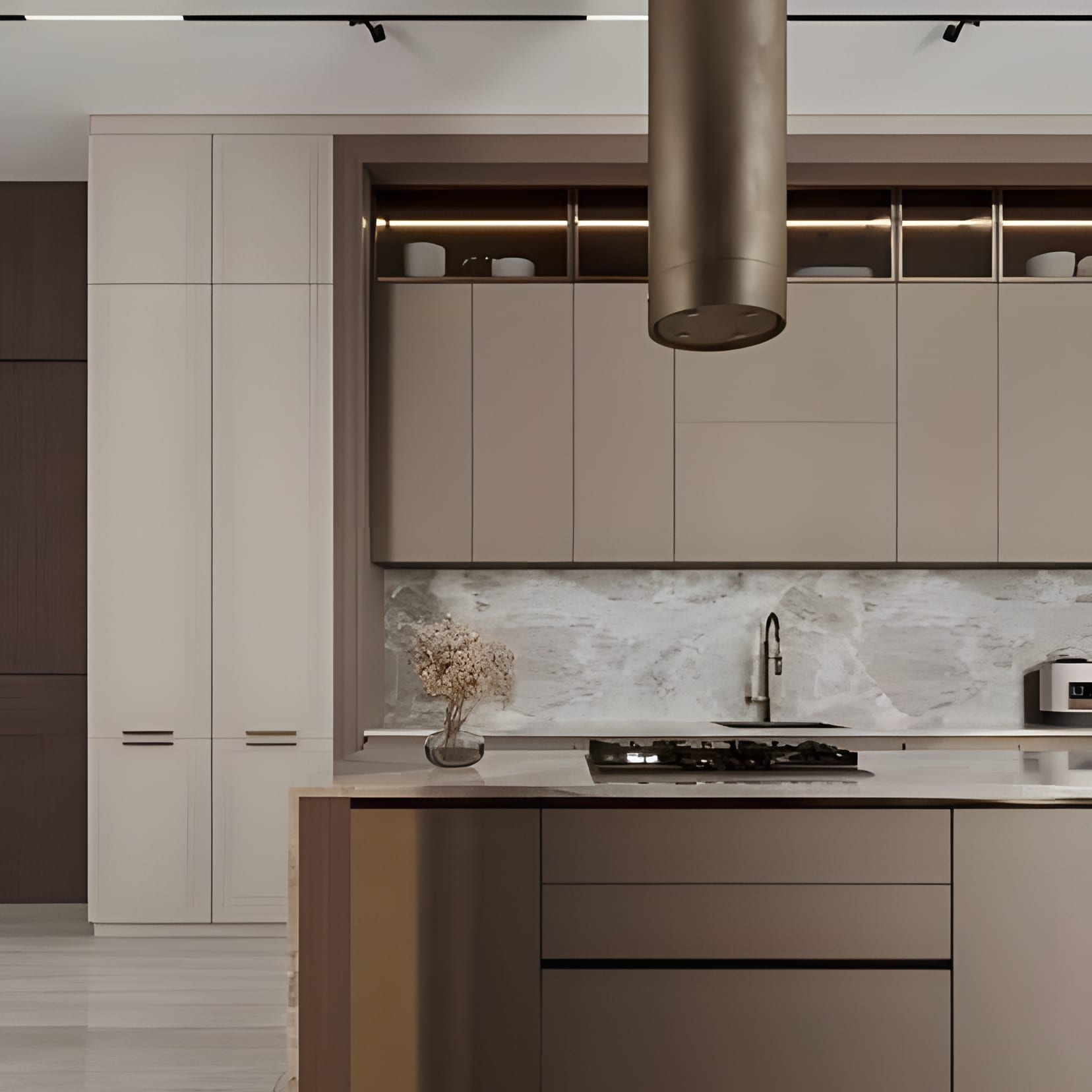 Greige cabinetry with a bronze cylinder pendant and a marble backsplash lit from above.