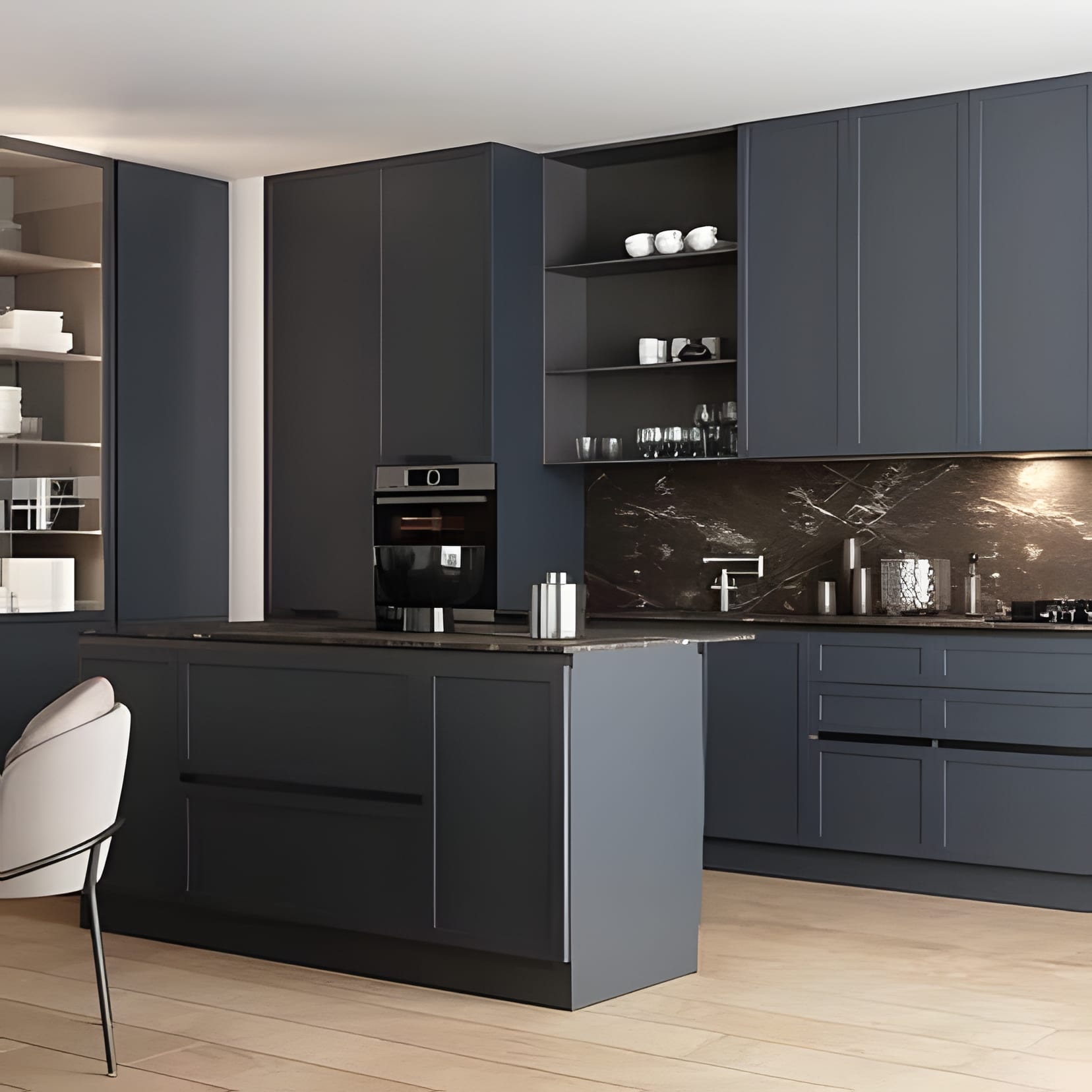 Blue-grey cabinetry with open shelves and a dark marble backsplash, navy island at the centre.