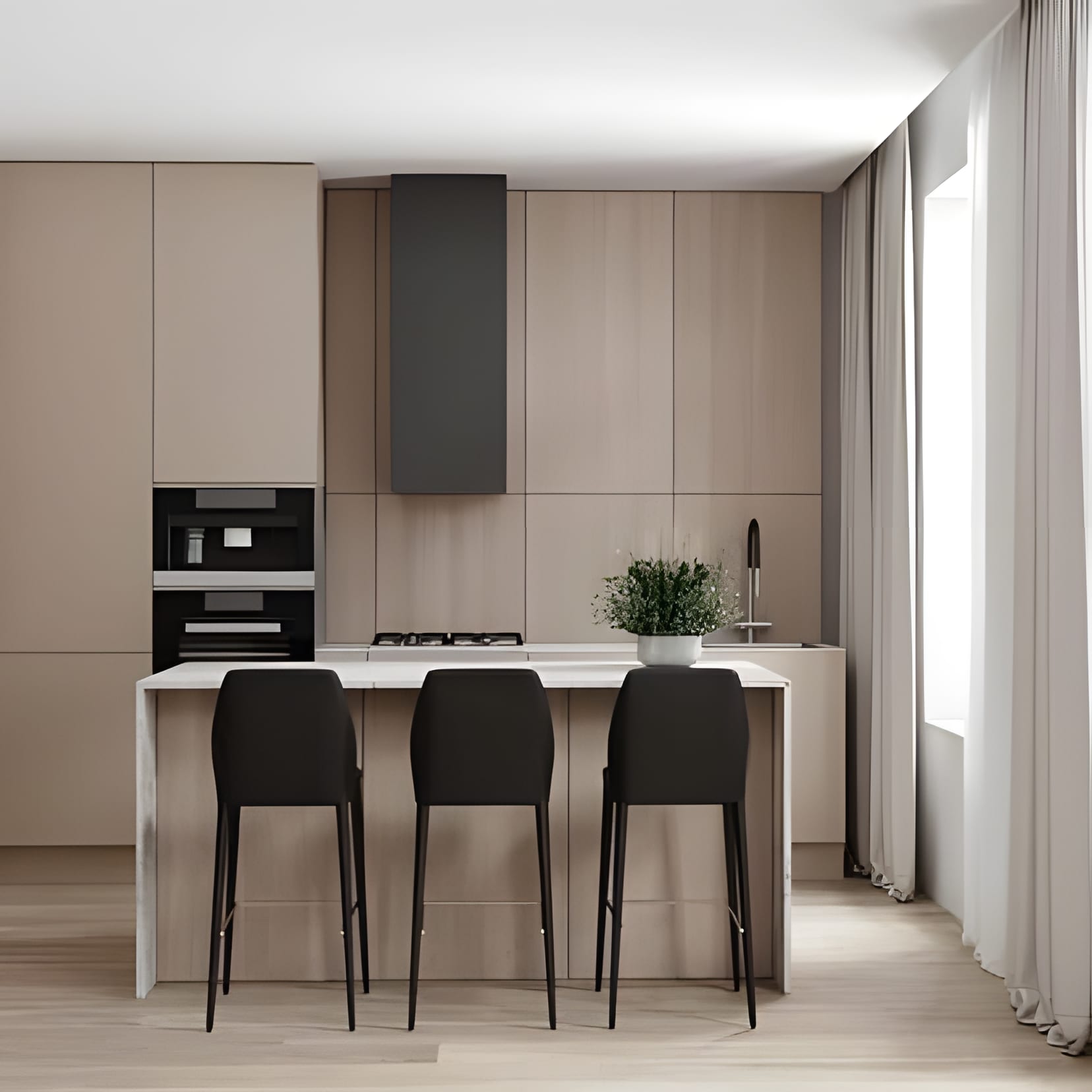 A calm beige kitchen with a slim island, high black stools, and a column hood — everything in one gentle tone.
