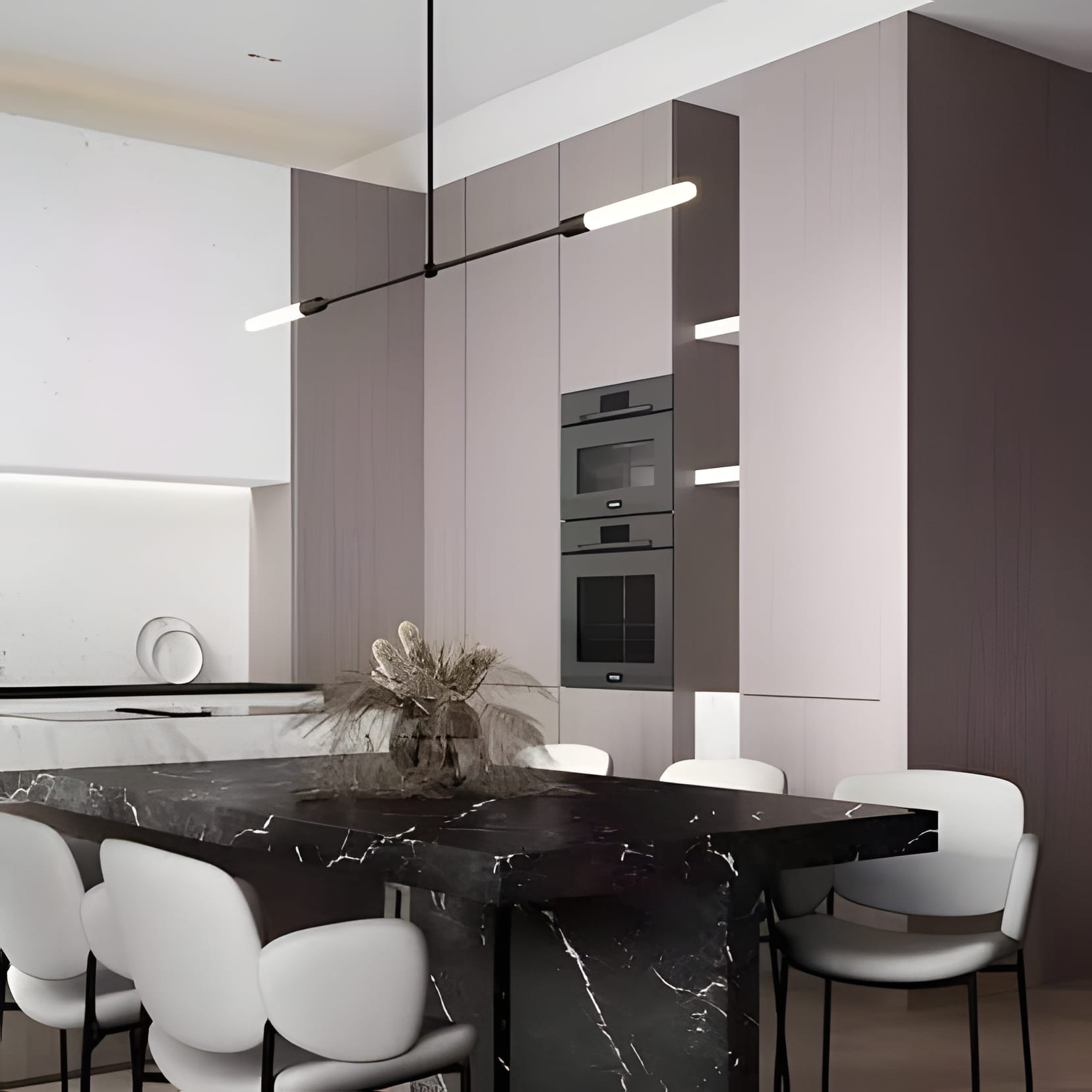 A black marble dining table with white chairs in a taupe kitchen — the table gets the last word.