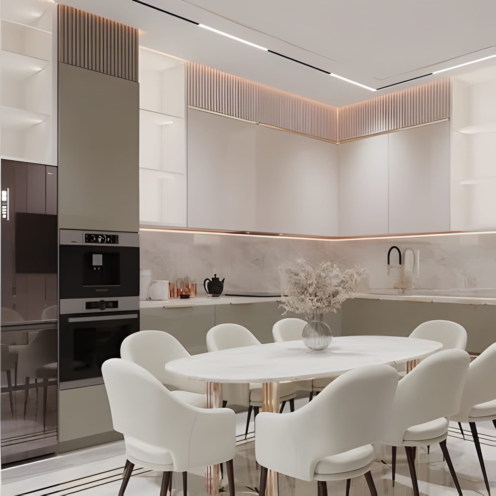 A white kitchen with lit ceiling coves and an oval dining table ringed in white chairs.