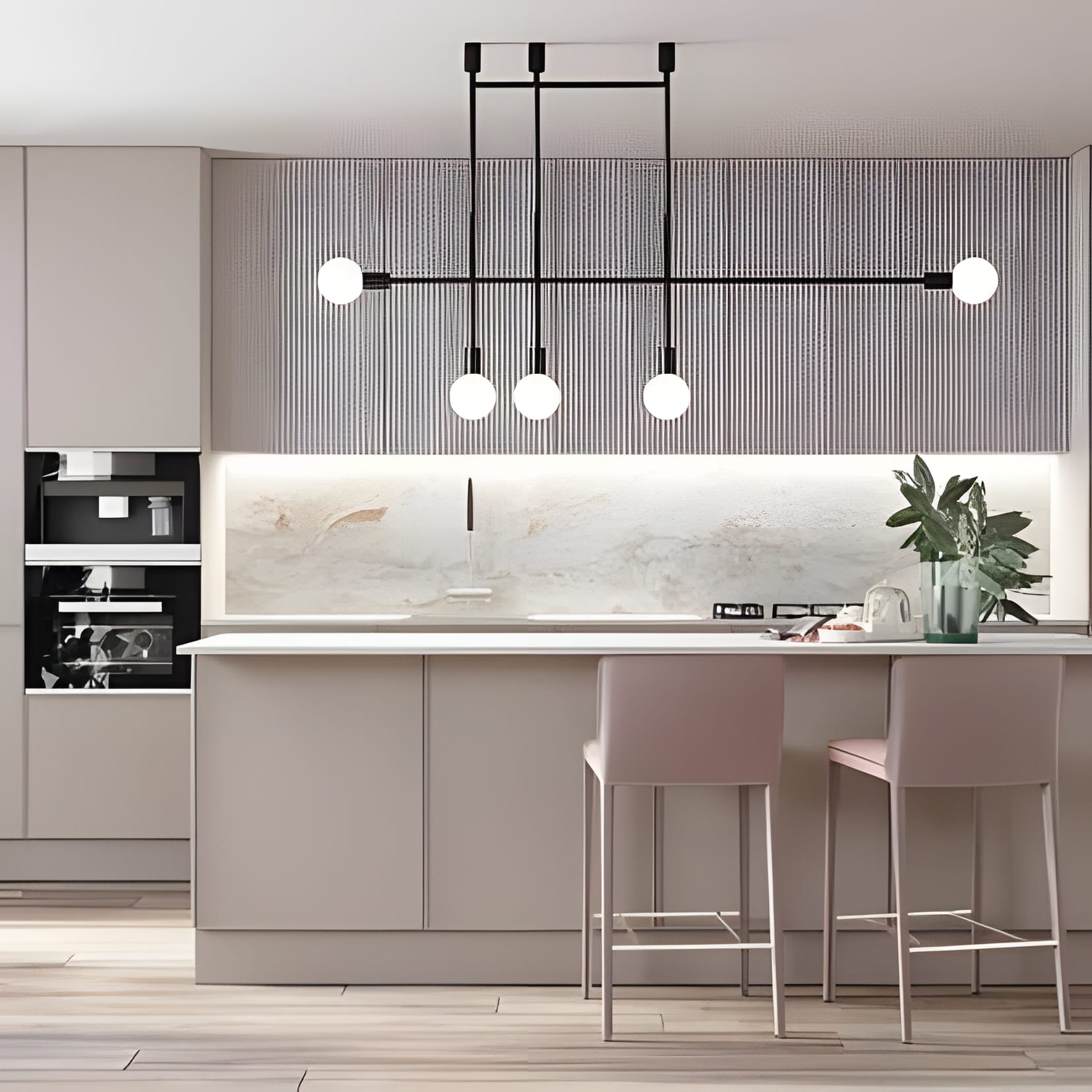 Greige cabinetry with a linear black pendant and blush stools pulled to the counter.