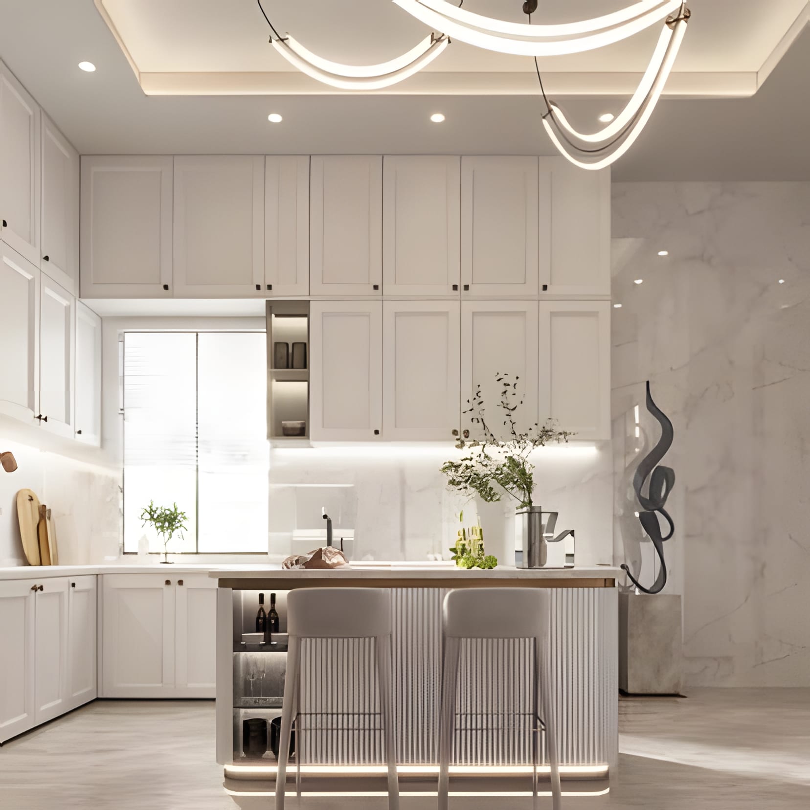 White classic cabinetry under a halo chandelier of overlapping rings, sculpture on the counter.