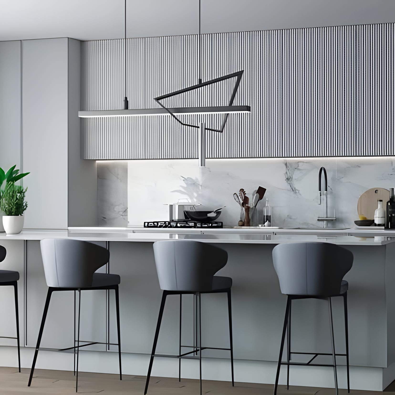 A grey-blue fluted wall and a geometric wire pendant over the island bar.